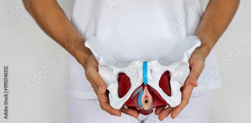 Fotografie The woman experiences lower back pain due to pelvic problems concept