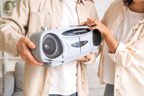 Young couple with boombox a...