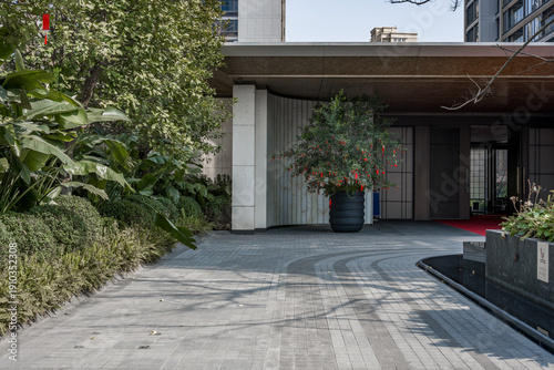 Wallpaper Mural Modern architectural entrance with greenery landscape, stone paving, and courtyard design Torontodigital.ca