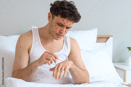 Ill young man with cotton s...