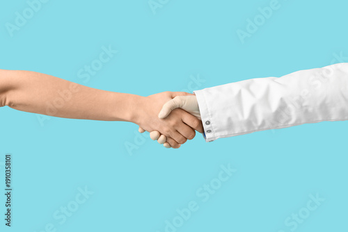 Doctor shaking hand of pati...