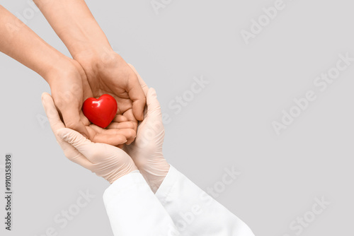 Doctor and patient holding ...