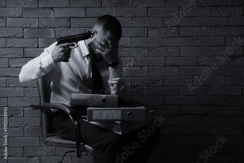 Businessman with gun and fo...