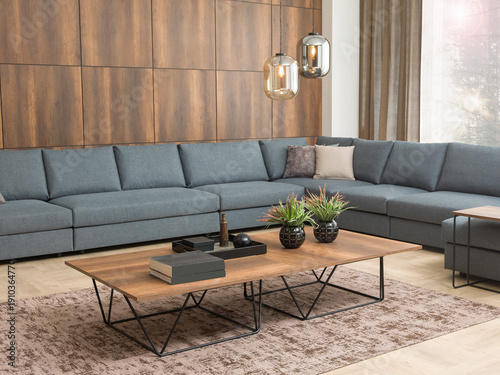 modern interior with stone wall decoration and special design lamp, sofa and parquet. decorative background for home, hotel, office