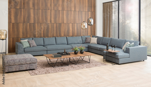 modern interior with stone wall decoration and special design lamp, sofa and parquet. decorative background for home, hotel, office