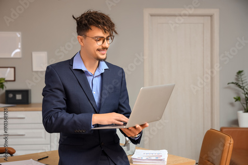 Young male bank manager wor...