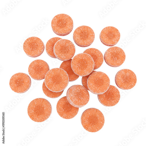 Group of small carrots round tablets or pills for pharmacy and healthcare supplement concept