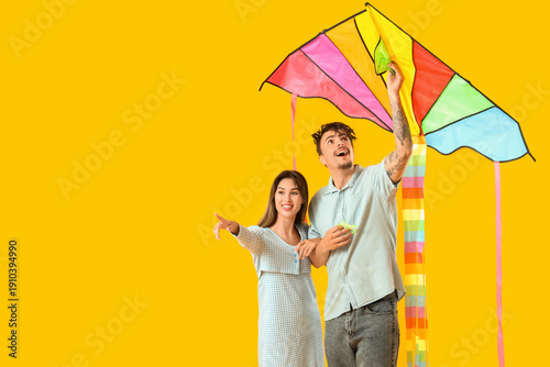 Happy young couple flying c...