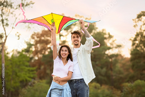 Happy young couple flying c...