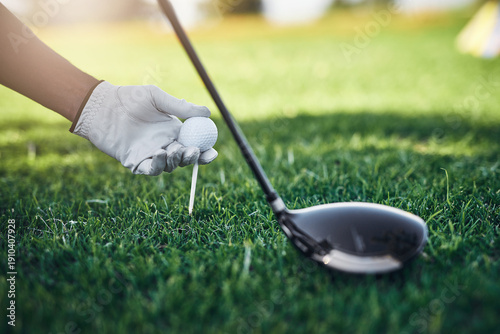 Foto Hands, golf ball and tee off at country club for games, contest and gloves with sports equipment on grass