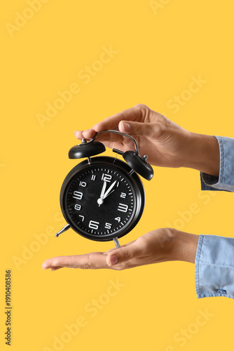 Female hands with alarm clo...