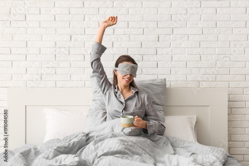 Happy young woman in sleep ...