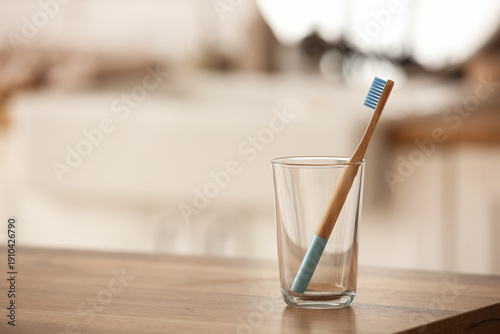 Glass with bamboo toothbrus...