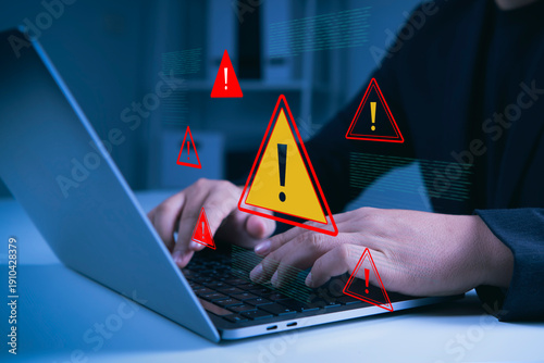 Photography Cybersecurity warning alert interface on laptop identifying system risks detecting digital threats preventing data breaches online safety monitoring and proactive IT security management