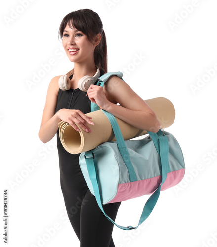 Young woman with sports bag...
