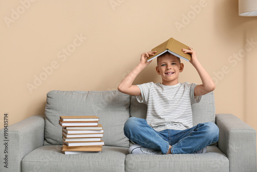 Cute little boy making roof...