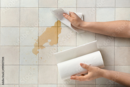 Woman wiping spilled coffee...