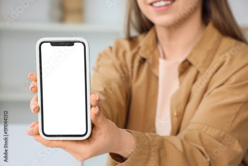 Young woman holding mobile ...