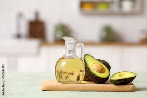 Jug of fresh oil and wooden...