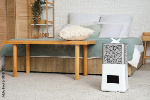 Modern humidifier on floor ...