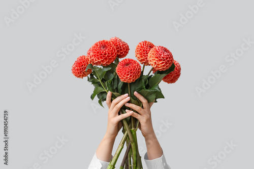 Female hands with bouquet o...