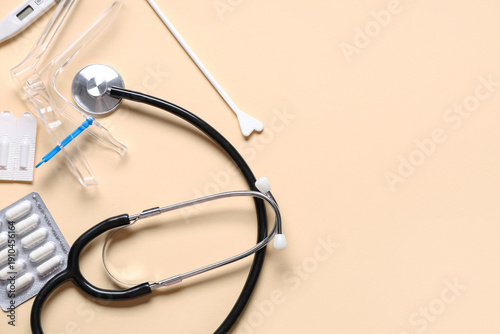 Bild auf Leinwand Set of gynecological supplies and stethoscope on beige background