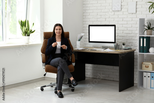 Female office worker with c...