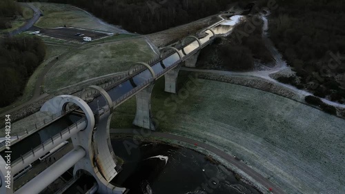 Explore the breathtaking Falkirk Wheel boat lift and aqueduct from above, revealing its stunning design and surrounding beauty