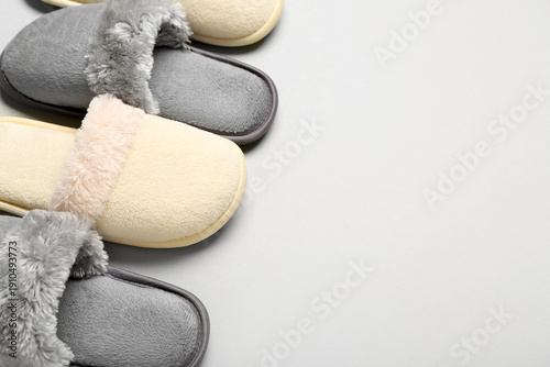 Two pairs of slippers on gr...