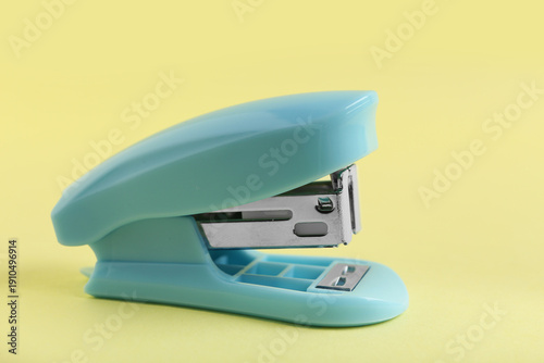 Blue stapler on yellow back...