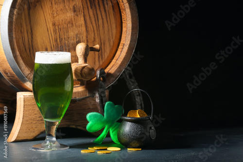 Glass of green beer with ba...