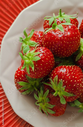 Close-up of fresh strawberries in a ceramic bowl