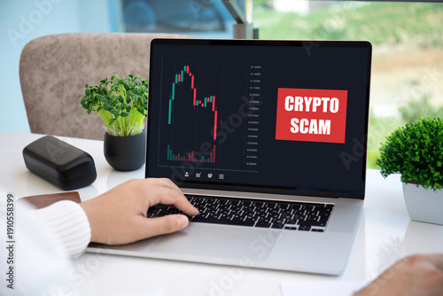 man working laptop with chart scam crypto coins on screen