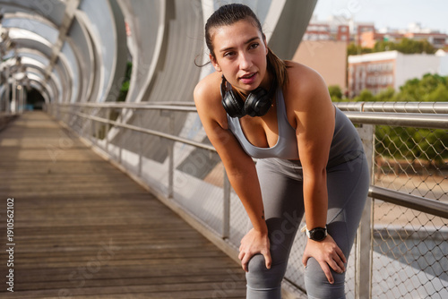 Photos Woman catching breath after fitness running workout