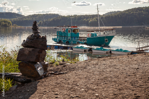 An old fishing boat is moored at the pier