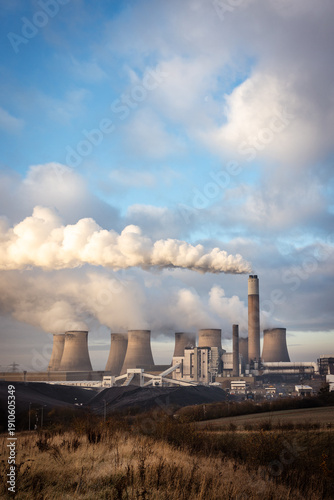 Power station generating energy with cooling towers pollution