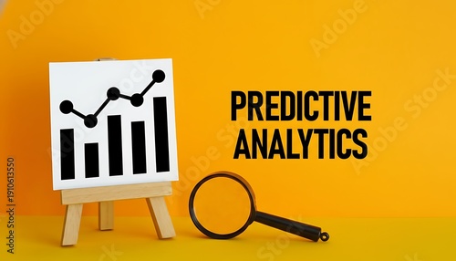 Chart analytics icon on easel with rising bar graph and line trend, magnifying glass and bold predictive analytics text on yellow background, business forecasting concept