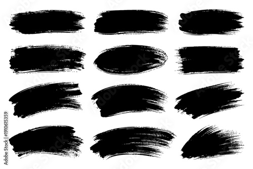 Set of 12 black grunge brush strokes on white background.