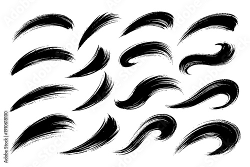 Set of artistic black brush strokes of varying shapes and styles on white background.