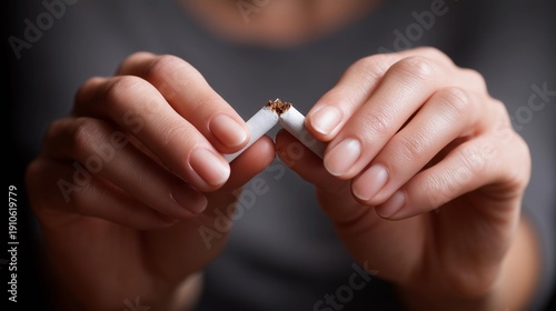 Hands holding a cigarette, concept of health and prevention,copy space,world no tobacco day.