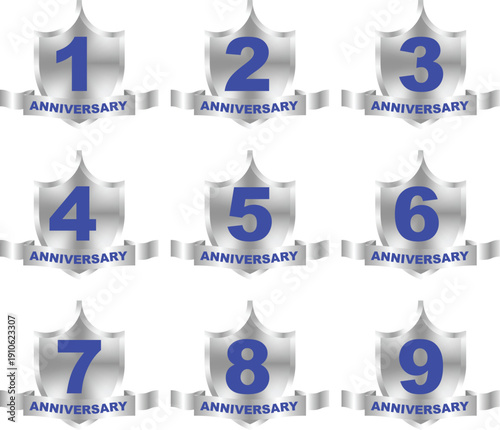 A collection of silver shield anniversary badges with blue numbers 1 through 9 and 'ANNIVERSARY' banners.