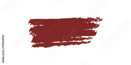 A smear of dark red lipstick on a white background resembling a bold cosmetic product test