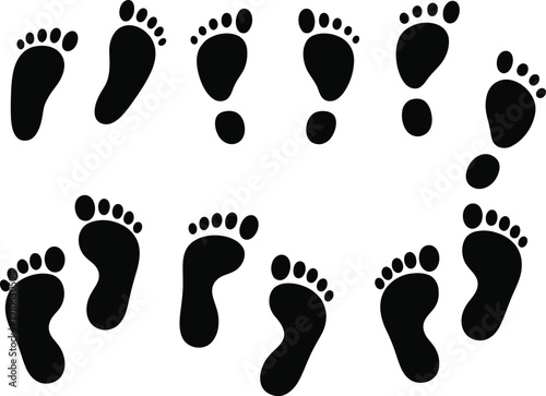 Collection of various black human footprints and foot silhouettes on a white background