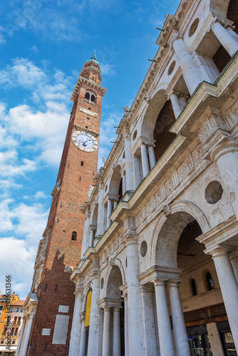 Wallpaper Mural Basilica Palladiana and Torre Bissara tower stand tall in Piazza della Signoria in Vicenza, Italy under a blue sky with scattered clouds Torontodigital.ca