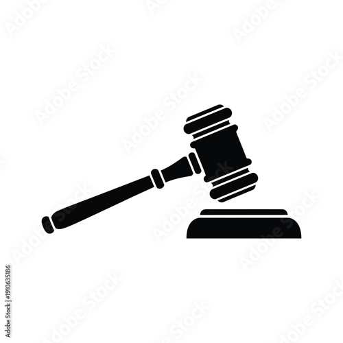 A black and white illustration of a gavel resting on a sound block