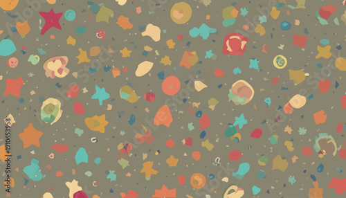 Vibrant multicolored confetti scattered on a textured gray surface, creating a festive atmosphere from a directly overhead viewpoint