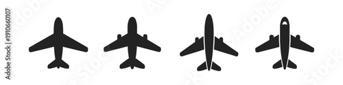 Collection of four black airplane icons in silhouette on a white background