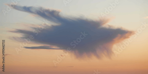 A beautiful airplane glides through a bright summer cloudscape as the orange sunlight of a nature-filled sunset paints the evening sky in shades of red and yellow at dusk