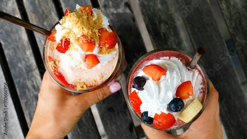 Vászonkép Two fruit smoothies with whipped cream topping