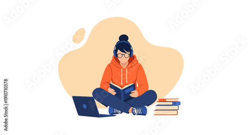 Young woman wearing glasses reading a book while sitting cross legged.